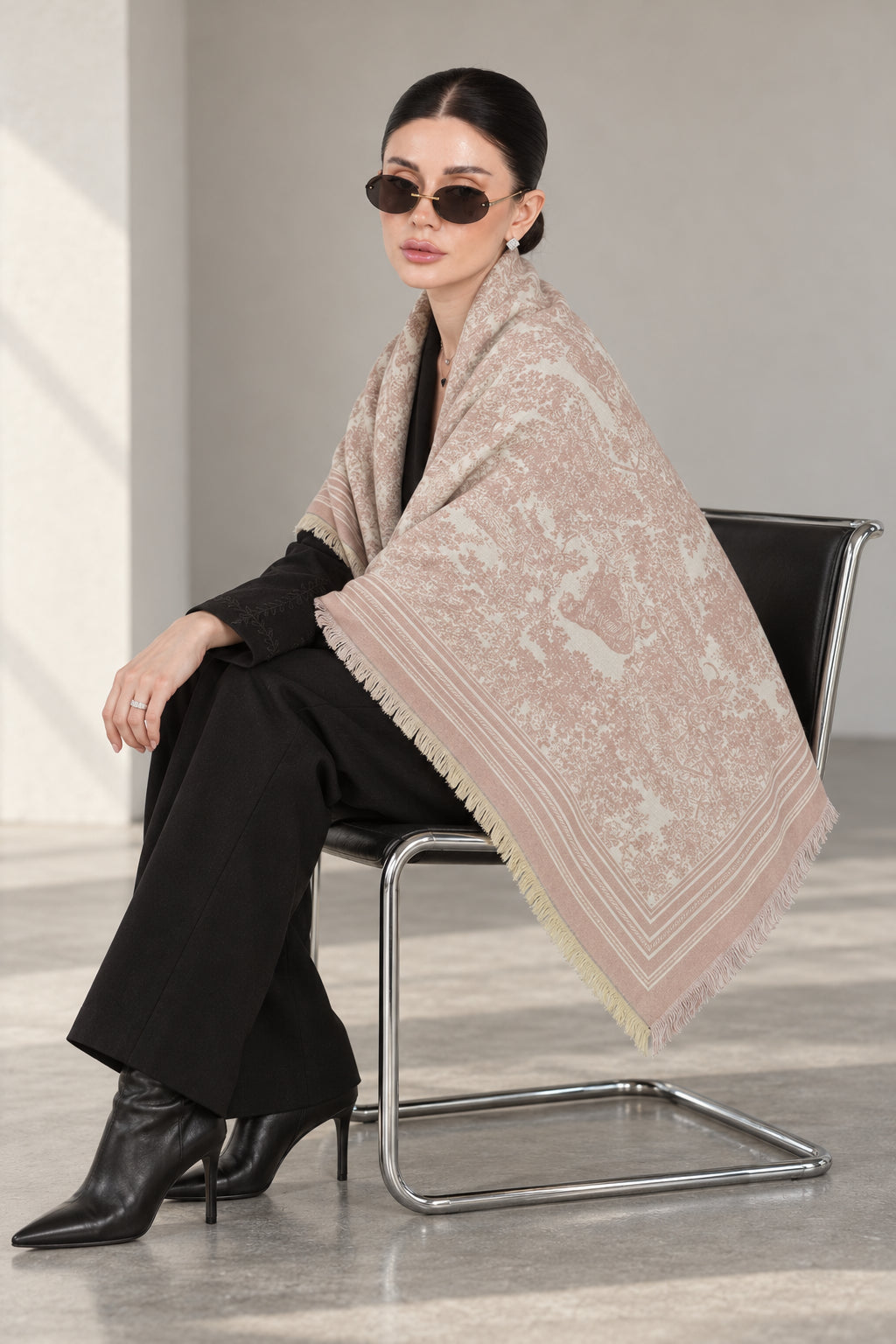 LIGHT PINK GULABI cashmere animal print square shawl folded into a triangle — seated